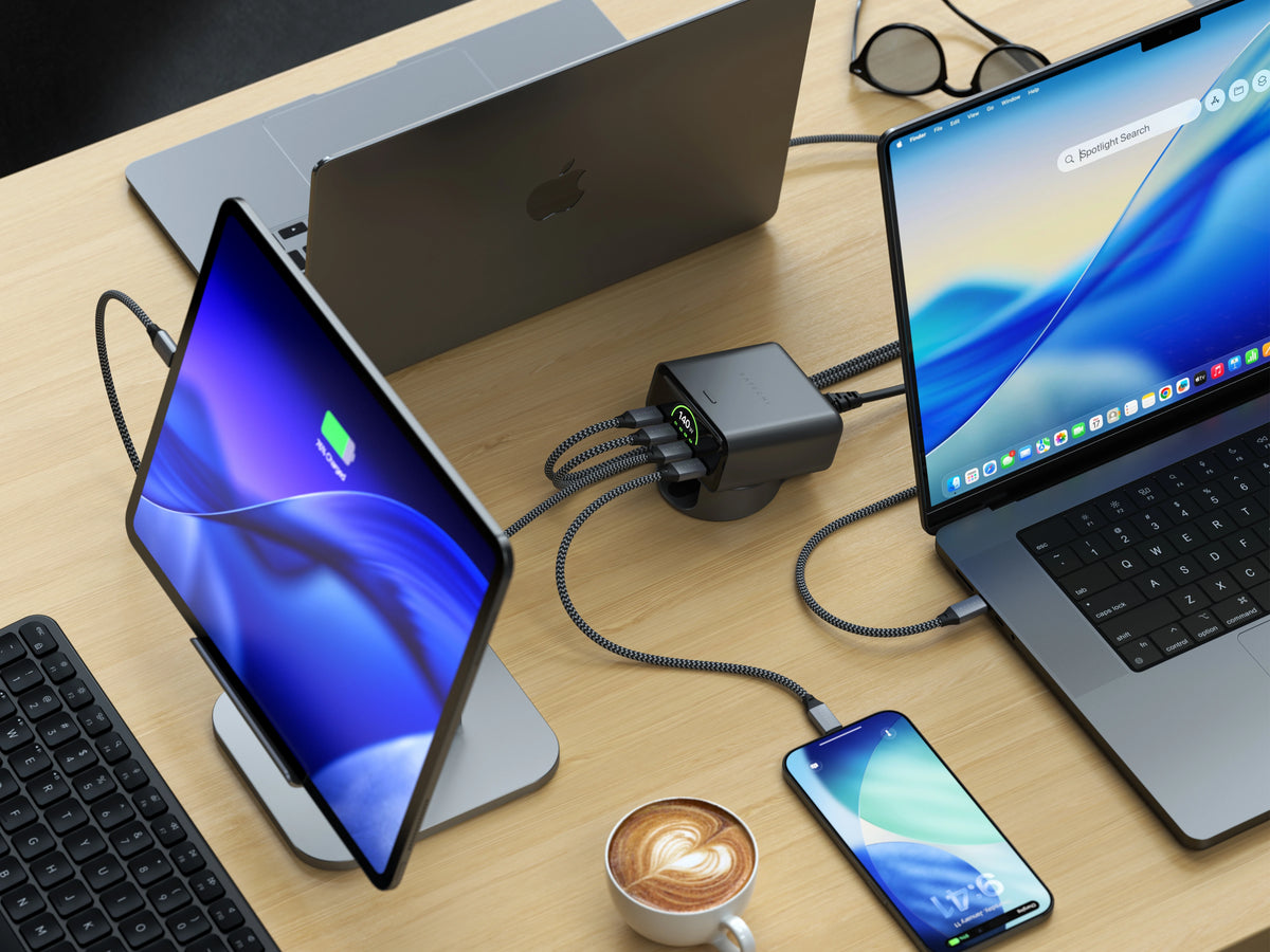 Satechi ChargeView™ 140W desktop charger powering multiple devices simultaneously, delivering fast USB‑C charging for MacBooks, iPad, and iPhone on a modern workspace.
