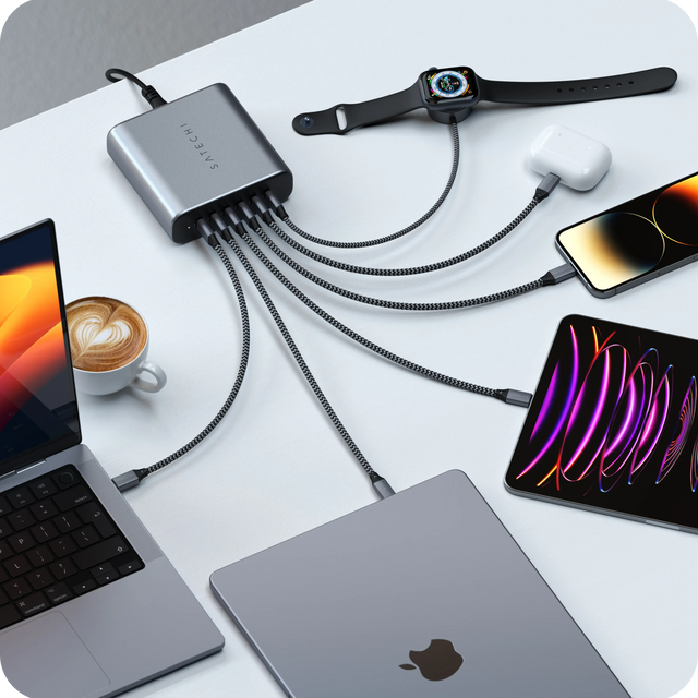 Satechi  200W USB-C 6-Port PD GaN Charger charging multiple devices at once, including MacBook, iPad, Apple Watch,  Laptop, iPhone, and AirPods.