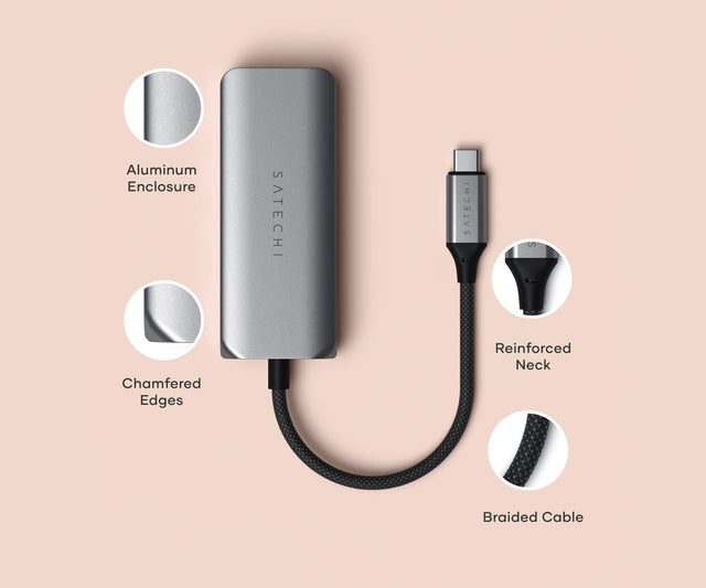Satechi 4‑in‑1 USB‑C Hub with 2.5 Gigabit Ethernet displayed on a pink background, highlighting its aluminum enclosure, chamfered edges, reinforced cable neck, and braided USB‑C cable.