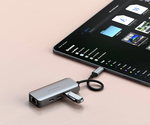 Satechi 4‑in‑1 USB‑C Hub with 2.5 Gigabit Ethernet connected to an iPad with USB drives plugged into the hub, showing fast wired networking and multiport expansion.