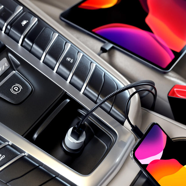 One iPhone and an iPad charging  while connected to the Satechi 72W Type-C PD Car Charger Adapter in car's dashboard, delivers up to 60W USB-C Power Delivery fast charging.
