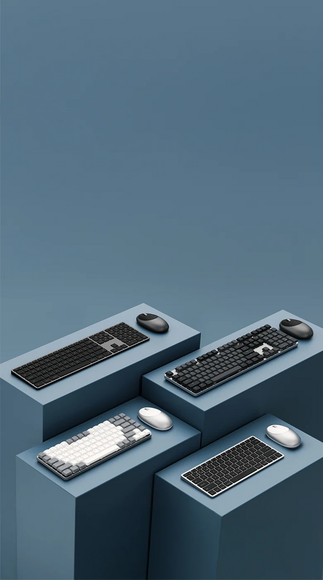 Multiple wireless keyboards and M1 Mouse arranged on tiered pedestals. Slim X3 Bluetooth Backlit Keyboard , SM3 Slim Mechanical Backlit Bluetooth Keyboard, SM1 Slim Mechanical Backlit Bluetooth Keyboard, and Slim X1 Bluetooth Backlit Keyboard. Each keyboard and mouse promoting the available bundle. 