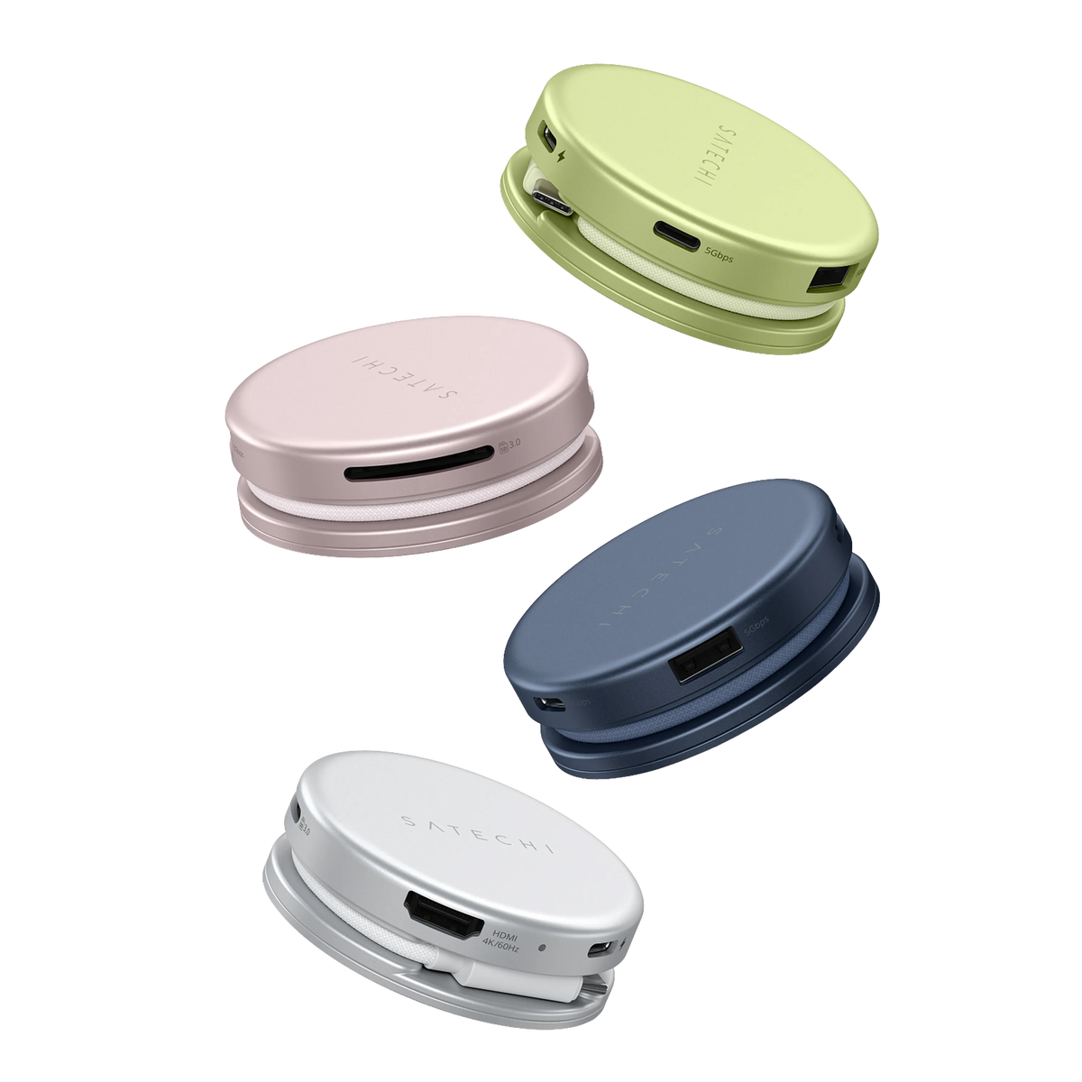 Four Satechi OntheGo™ 5-in-1 Multiport Adapter hubs floating in Citrus, Blush, Indigo, and Silver, each puck-shaped magnetic usb c hub showing its coiled braided cable and port labels including "5Gbps," "SD 3.0," and "HDMI 4K/60Hz," with the SATECHI logo on top.