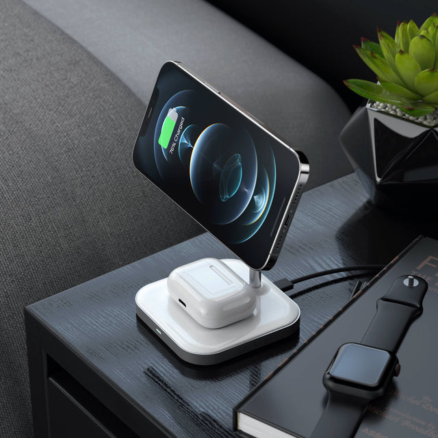 Satechi Aluminum 2-in-1 Magnetic Wireless Charging Stand charging an iPhone and AirPod, the iPhone is displaying charging status beside stand.