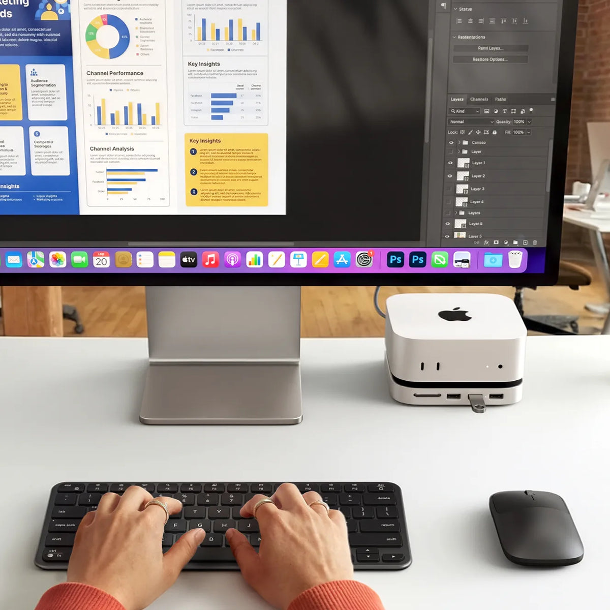Slim CEX1 Wireless Combo shown with a person typing on the Slim EX1 wireless keyboard and using the Slim EX wireless mouse at a desktop workstation with a large monitor Mac mini M4 and Satechi Mac Mini M4 Stand & Hub with SSD Enclosure.