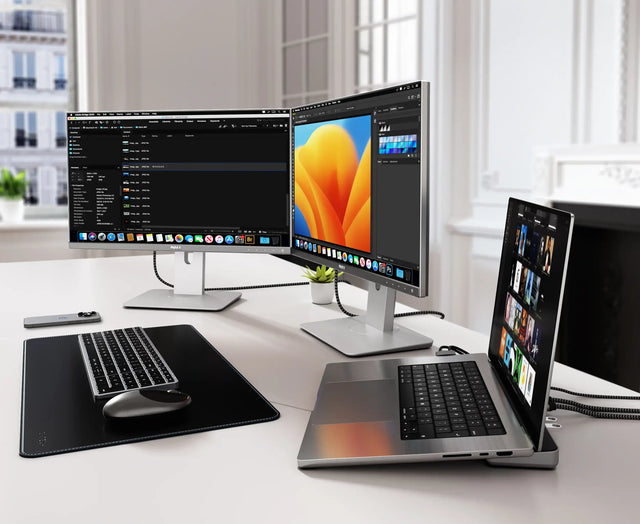 Workstation with a laptop connected to the Satechi Dual Dock Stand, displaying dual external monitors for expanded desktop productivity.