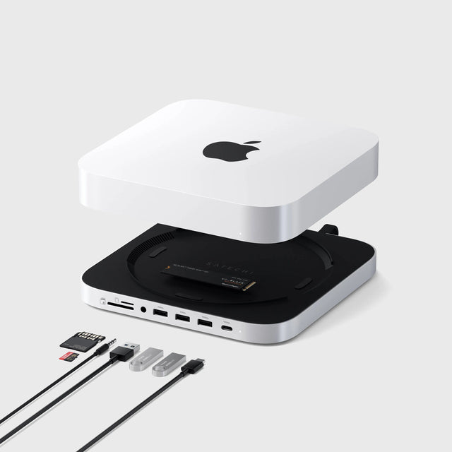 A Mac Mini attaching to a Satechi Stand & Hub For Mac Mini / Studio With NVMe SSD Enclosure, showing multiple USB-A ports, a USB-C port, NVMe/M.2 SATA SSD Enclosure, Micro/SD card readers, and 3.5mm Audio Jack. 