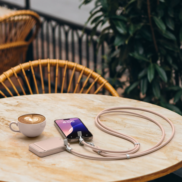 An iPhone charging with a OntheGo™ USB-C Lanyard Cable and OntheGo™ Power Bank (10K).