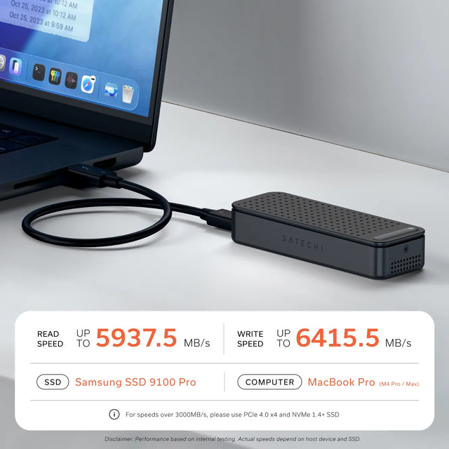 Black Satechi DotDisk Thunderbolt 5 SSD enclosure connected to a MacBook Pro on a desk via a Thunderbolt cable. Benchmark results: READ SPEED UP TO 5937.5 MB/s. WRITE SPEED UP TO 6415.5 MB/s. SSD: Samsung SSD 9100 Pro. COMPUTER: MacBook Pro (M4 Pro / Max). For speeds over 3000MB/s, please use PCIe 4.0 x4 and NVMe 1.4+ SSD. Disclaimer: Performance based on internal testing. Actual speeds depend on host device and SSD.