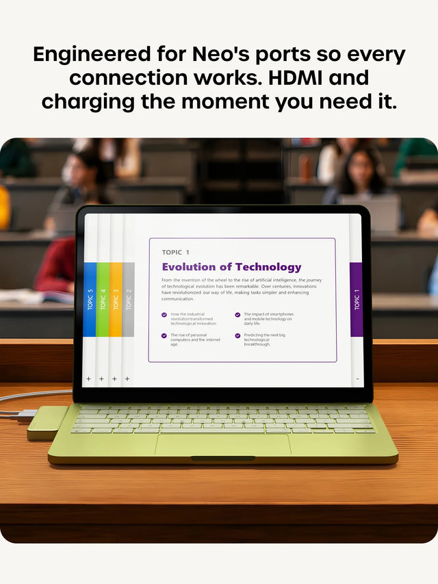 A Citrus green MacBook Neo on a lecture-hall desk connected to the matching Satechi USB-C Snap Hub, its screen showing an "Evolution of Technology" presentation with TOPIC 1–5 side tabs. Headline reads "Engineered for Neo's ports so every connection works. HDMI and charging the moment you need it."