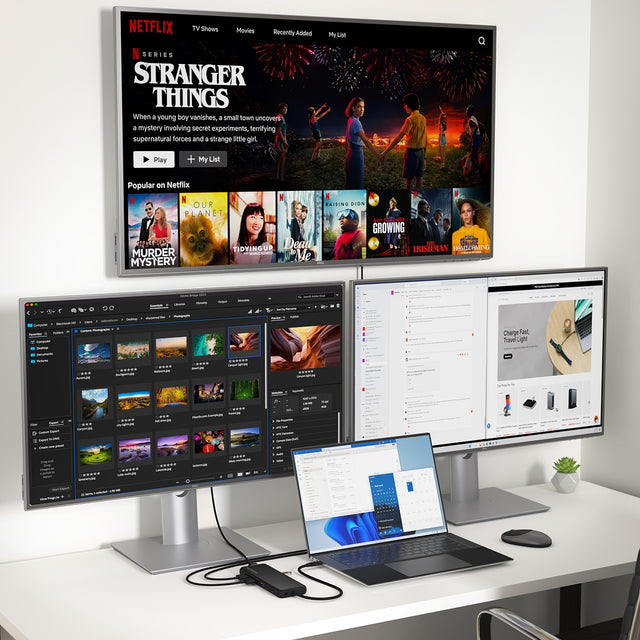 13‑in‑1 USB‑C Triple Display Multiport Adapter connected to a MacBook powering three external monitors, showcasing streaming content, photo editing software, and productivity dashboards in a clean multi‑screen workspace.
