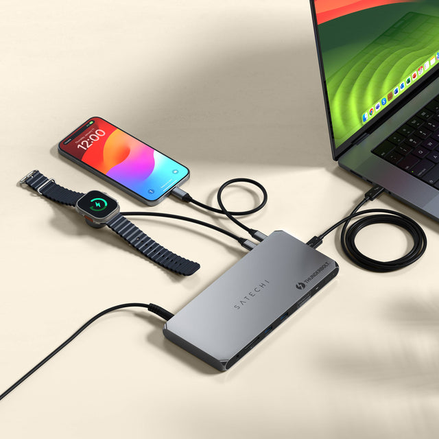 A Thunderbolt 4 Docking Station with DisplayLink connected to a laptop, a and charging an iPhone and Apple Watch on a light background demonstrating 180W Power Supply.
