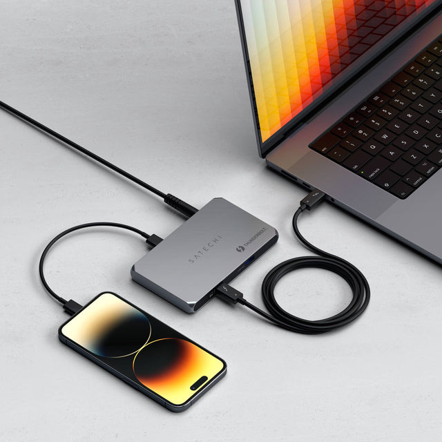 Thunderbolt 4 Slim Hub connected to a MacBook and charging an iPhone, showing PD 60WUSB 3.2 Gen 2 Data Port - up to 10gbps and 3x Thunderbolt 4 Downstream Ports 40 Gbps, 15W.