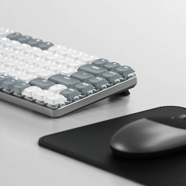 Side view of the SM1 Slim Mechanical Backlit Bluetooth Keyboard showing low‑profile mechanical key switches and a sleek aluminum frame.