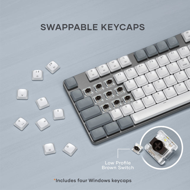 Swappable keys next to the SM3 Slim Mechanical Backlit Bluetooth Keyboard, revealing the low-profile brown switches. Includes four Windows keycaps.