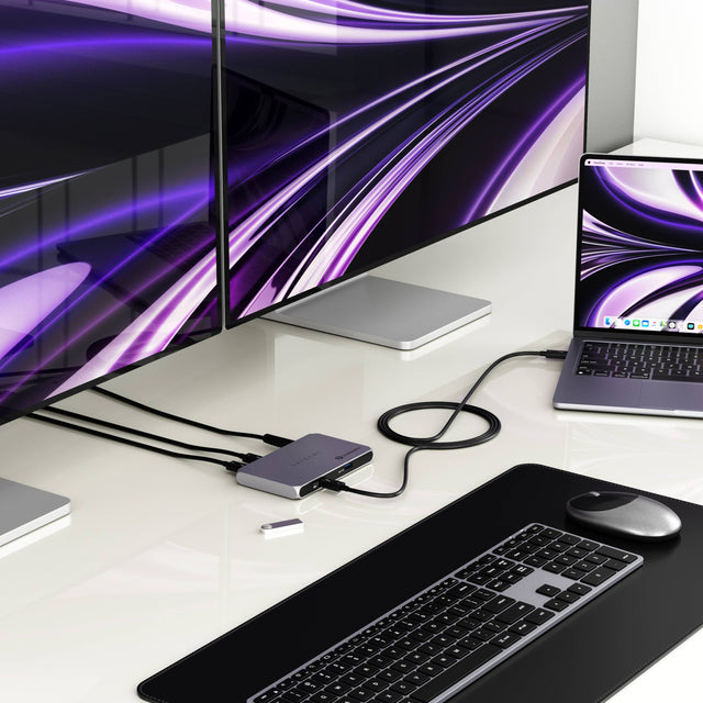 The Thunderbolt 4 Slim Hub displaying two external monitors at 4K at 60Hz while connected via a Thunderbolt 4 cable to a MacBook. 