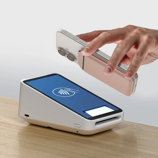 A person using contactless payment scanner with the The Vegan-Leather Magnetic Wallet Stand attached to their phone. 