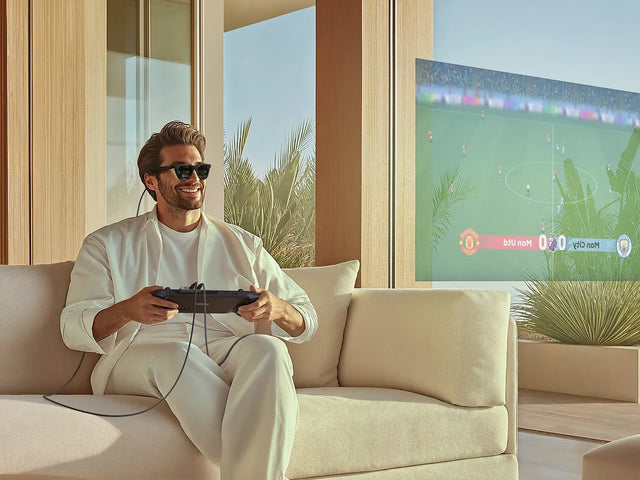 Satechi Mobile XR Hub with Audio connected to a handheld gaming device, projecting an immersive XR gaming display in a modern living room environment.